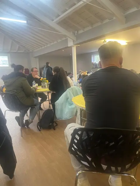 Friends sharing lunch together at the Thursday Community Café Full Gospel Tabernacle Birmingham