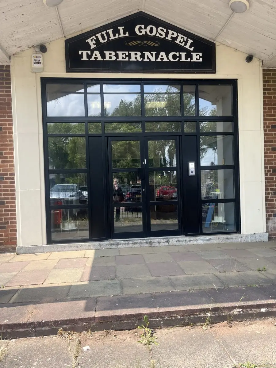 Entrance doors and sign of Full Gospel Tabernacle Birmingham