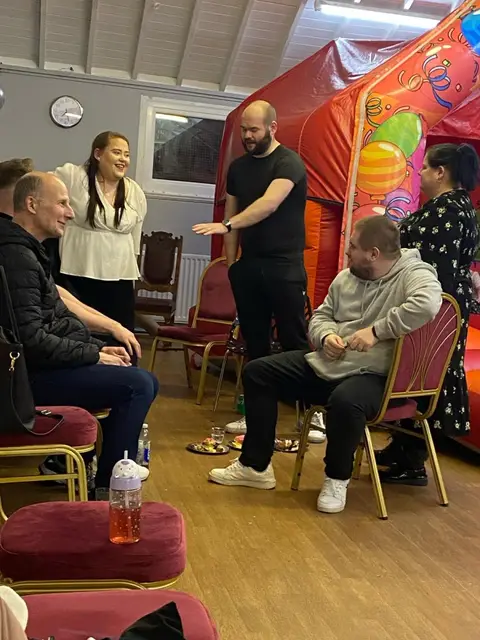 Guests chatting at a Full Gospel Tabernacle community day Birmingham