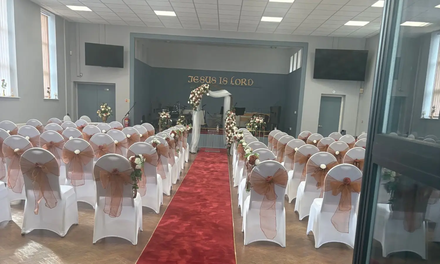 Main church hall at Full Gospel Tabernacle set out with a red aisle carpet Birmingham